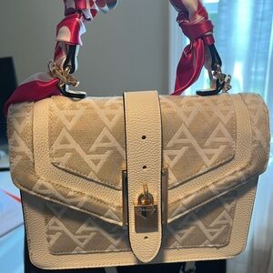 Aldo purse, used once. It’s too small for my purse contents.